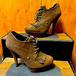 G by Guess brown high heel ankle booties. Lace up front with back zipper.